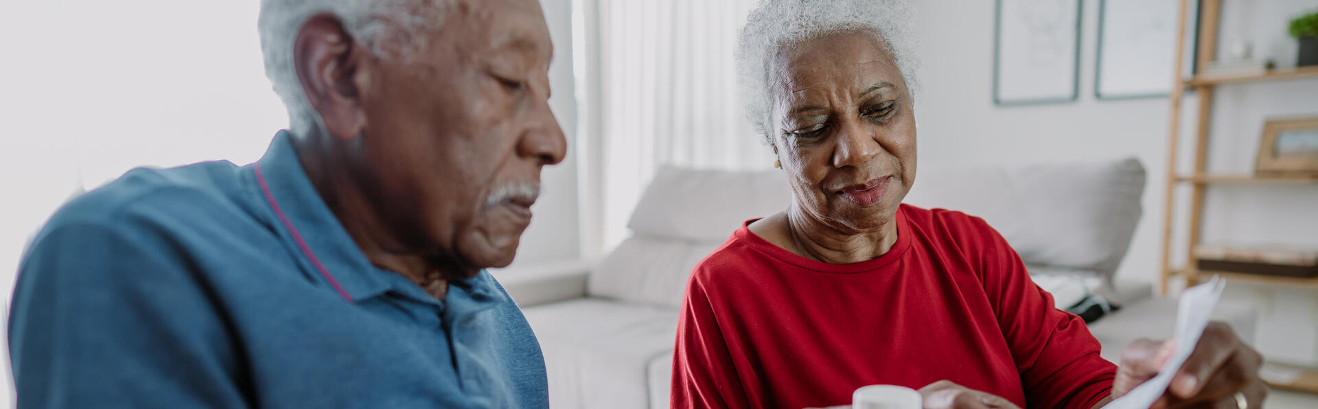 Elderly couple looking at their prescriptions